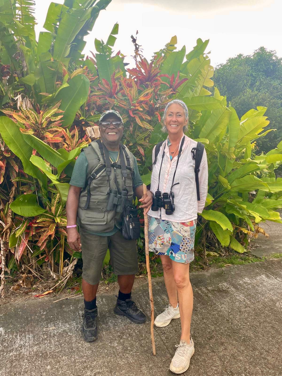 Scriber and a guest with binoculars before a birdwatching walk